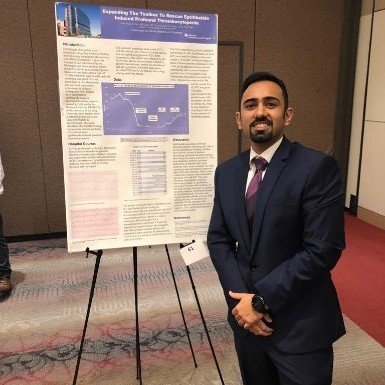 Man standing in front of presentation board.