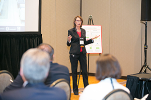 Woman is giving presentation in Market Transformation Group.